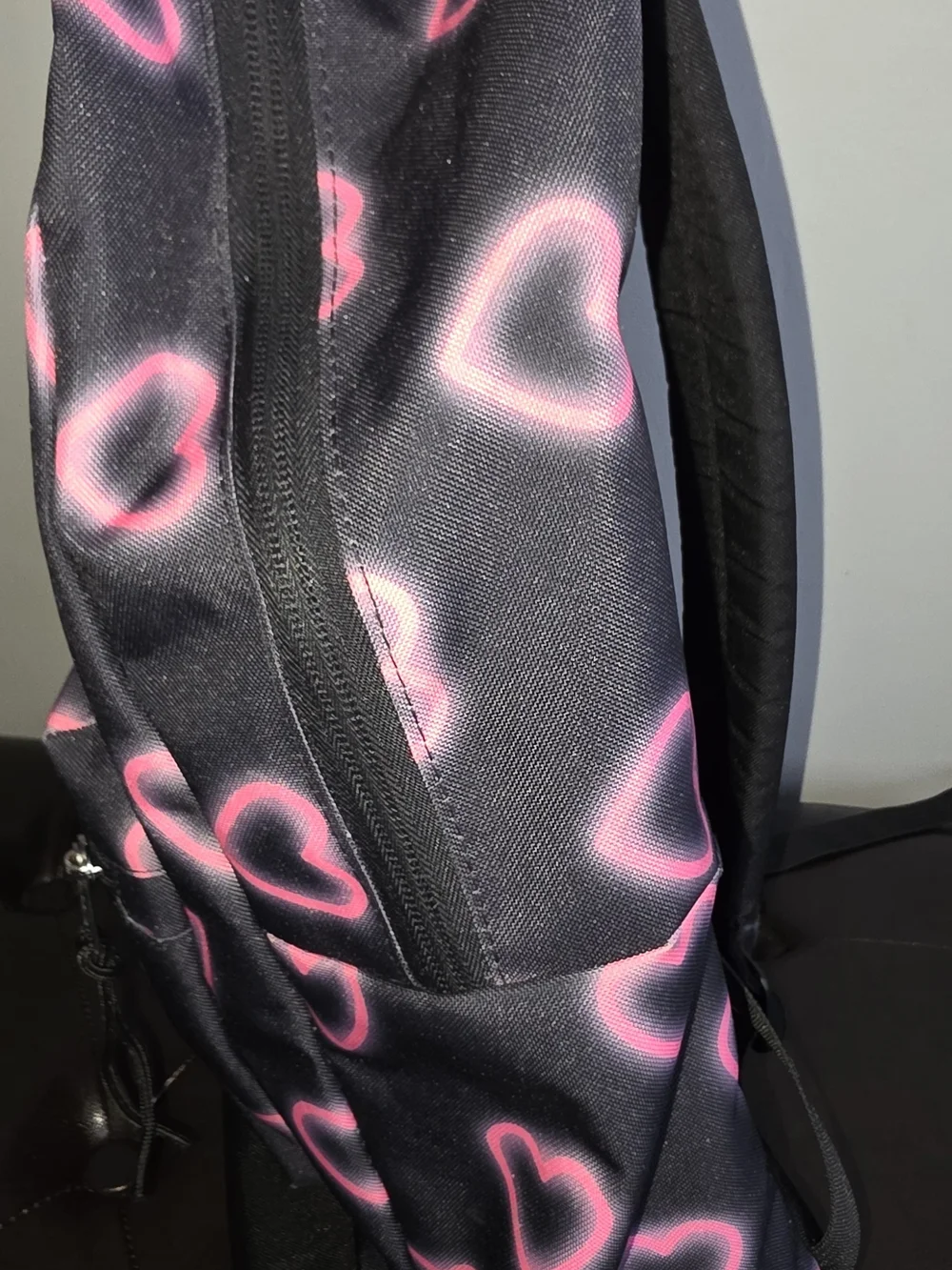 Jansport Black Backpack with Neon Pink Heart Pattern